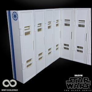 May include: White and blue Star Wars themed display case with multiple compartments. The case has a blue stripe and a symbol on the side. The text "SCALED FOR STAR WARS THE BLACK SERIES" is visible.