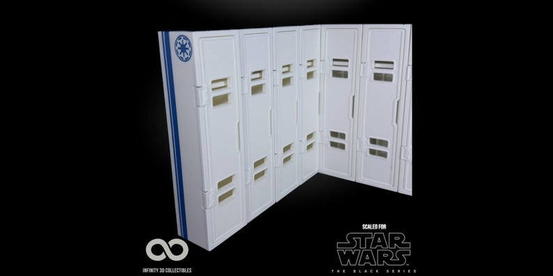May include: White and blue Star Wars themed display case with multiple compartments. The case has a blue stripe and a symbol on the side. The text "SCALED FOR STAR WARS THE BLACK SERIES" is visible.