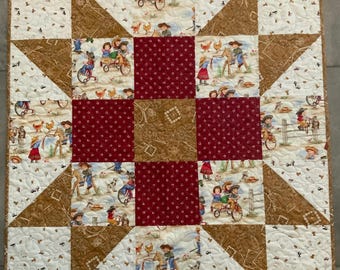 May include: A patchwork quilt with a star design in the center. The quilt is made of brown, white, and red fabric with a variety of patterns. The quilt features a whimsical country theme with children riding on toy vehicles and farm animals.