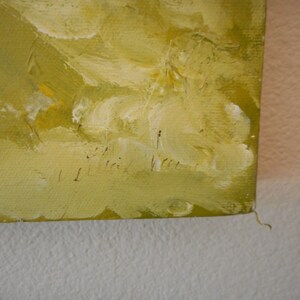 May include: A close-up of a yellow and green abstract painting with a signature in the bottom right corner. The signature reads "Ilrick Velle".