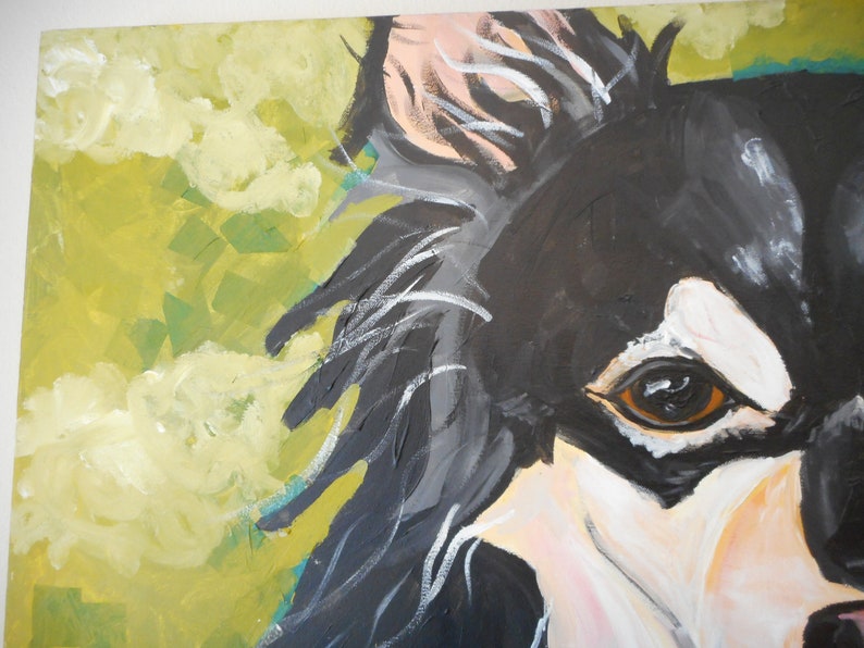 May include: Close-up of a black and white painting of a dog's face. The dog has a brown eye and a white patch of fur on its face. The background is a yellow-green colour.