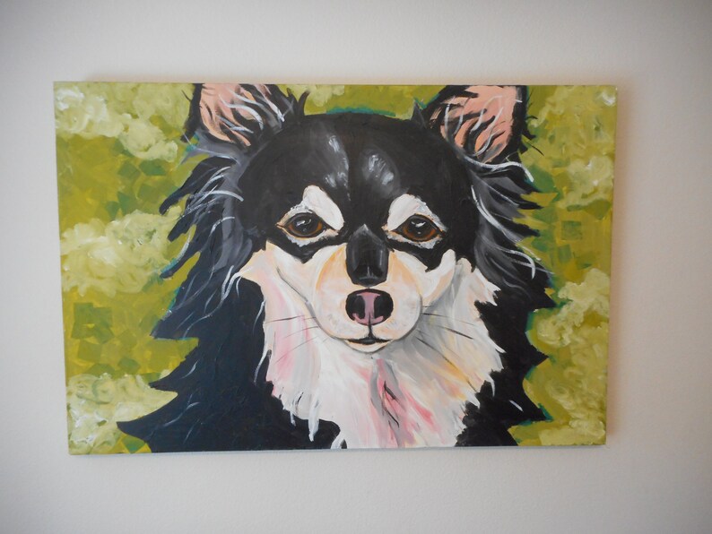 May include: A painting of a black and white chihuahua with brown eyes, looking directly at the viewer. The dog is painted on a green background with white clouds.