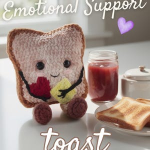 May include: A crocheted toast plushie with a smiling face, holding a red heart and a yellow square. The text "Emotional Support" and "toast CROCHET PATTERN" are visible. A jar of jam and toast slices are also in the image.