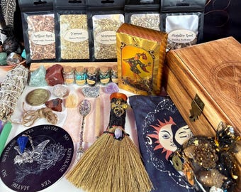 May include: An assortment of spiritual and metaphysical items, including herbs, crystals, tarot cards, a wooden box, a broom, and a divination board. The image features various colors and textures, creating a mystical aesthetic. The text on the board says "Maybe" and "Rephrase".