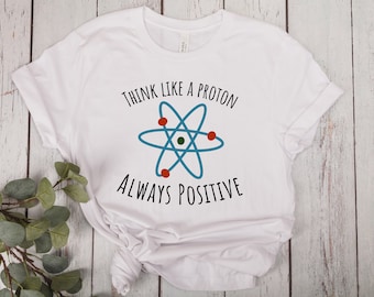 Denk als een proton, altijd positief | Uniseks T-shirt met korte mouwen