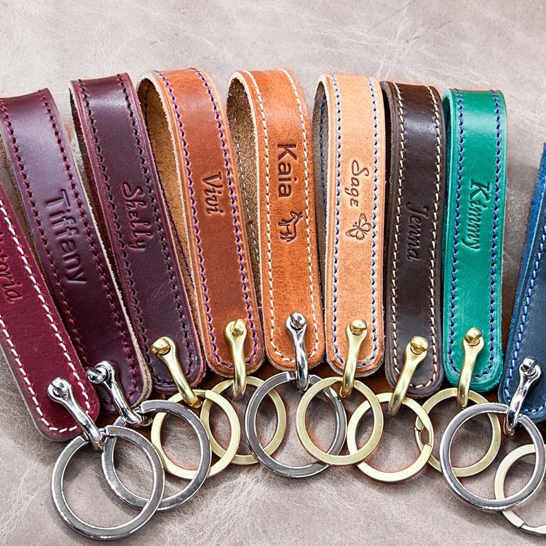 Handmade Personalized Leather Loop Keychain in your choice of American Horween leather and thread color with customizable text engraved into the leather. Premium hardware in solid brass, nickel and black finishes. Handmade to order in Houston, Texas by CustomLeatherAndPen
