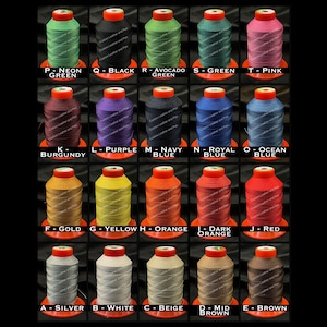 May include: A collection of 20 spools of waxed thread in various colors, including neon green, black, avocado green, pink, burgundy, purple, navy blue, royal blue, ocean blue, gold, yellow, orange, dark orange, red, silver, white, beige, and brown. Each spool is labeled with a letter and color name.