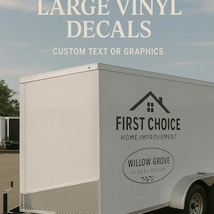 May include: White trailer with black accents and text that reads "CUSTOM LARGE VINYL DECALS" and "CUSTOM TEXT OR GRAPHICS". The trailer also features the logos for "FIRST CHOICE HOME IMPROVEMENT" and "WILLOW GROVE FLORAL DESIGN".