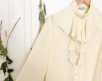cream frilly blouse