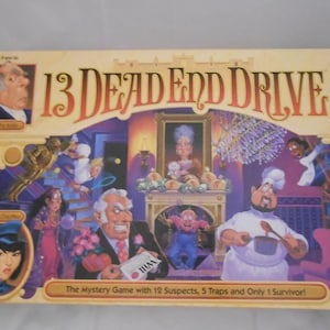 May include: A board game box titled "13 Dead End Drive." The box features illustrations of various characters, including a butler, maid, chef, and cat. The game's title is in large, ornate lettering, and the box includes the text "The Mystery Game with 12 Suspects, 5 Traps and Only 1 Survivor!"