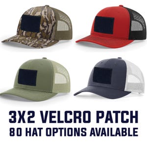 May include: Four baseball caps with a 3x2 inch Velcro patch. The caps are in various colors: camouflage, red, olive green, and navy blue. Each cap has a mesh back. The text at the bottom reads "3X2 VELCRO PATCH 80 HAT OPTIONS AVAILABLE."