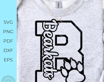 May include: A light gray crewneck sweatshirt featuring a large black letter R with the word Bearkats written vertically in a script font and a paw print graphic. The text SVG, PNG, PDF, DXF, EPS is visible on the left side of the image.