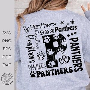 May include: A light gray sweatshirt with a black graphic design. The design features the word "Panthers" in various fonts and styles, along with paw prints, hearts, stars, and a sun. The letter "P" is prominently displayed.