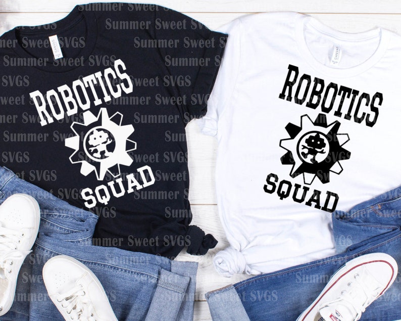 May include: Black and white t-shirts with the text "ROBOTICS SQUAD" and a gear graphic with a robot inside. The shirts are displayed on top of blue jeans and white sneakers.