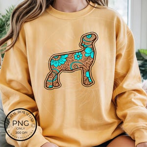 May include: Mustard-colored sweatshirt featuring a detailed illustration of a sheep. The sheep design is outlined in brown and filled with a floral pattern in shades of turquoise and brown. The words "DIGITAL DOWNLOAD PNG ONLY 300 DPI" are printed on the bottom left.