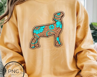 Imagen PNG de cordero de exhibición con estampado floral estilo western y diseño de cuero turquesa repujado, ideal para madres de ferias estatales, expositores de FFA y 4H.
