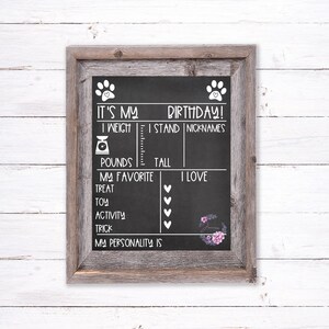 May include: Black chalkboard with a white paw print design. It's My Birthday! I Weigh, I Stand, Nicknames, Pounds, Tall, My Favorite, Treat, Toy, Activity, Trick, I Love.  My Personality Is.