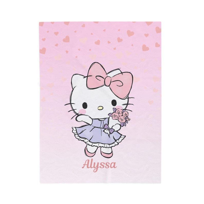 May include: A pink blanket featuring a cartoon illustration of a white cat with a pink bow, wearing a purple dress and holding flowers. The name "Alyssa" is written in pink script at the bottom. The background is light pink with heart shapes.