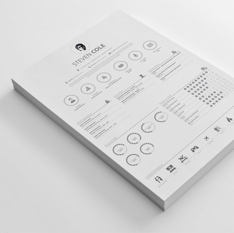 May include: A black and white resume with a photo of a man in the top left corner. The resume includes the name "Steven Cole" and the title "Graphic Designer". The resume is divided into sections for work experience, education, skills, and hobbies and interests.