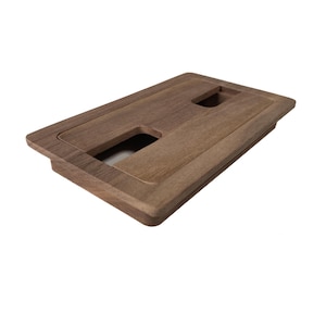 May include: A rectangular wooden floor register with two rectangular openings. The register is made of dark brown wood and has a slightly raised edge.