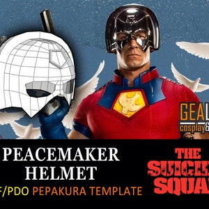 May include: A printable papercraft template for a Peacemaker helmet from The Suicide Squad movie. The template is a black and white line drawing of the helmet, with a grid pattern for folding and assembly. The image also shows a person wearing a silver helmet, a red and blue costume, and a red and yellow symbol on the chest.
