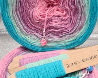May include: A skein of yarn in a gradient of pink, green, and blue colors. The yarn is wound into a ball shape and is ready to be used for knitting or crocheting. The yarn is labeled "275 - River".