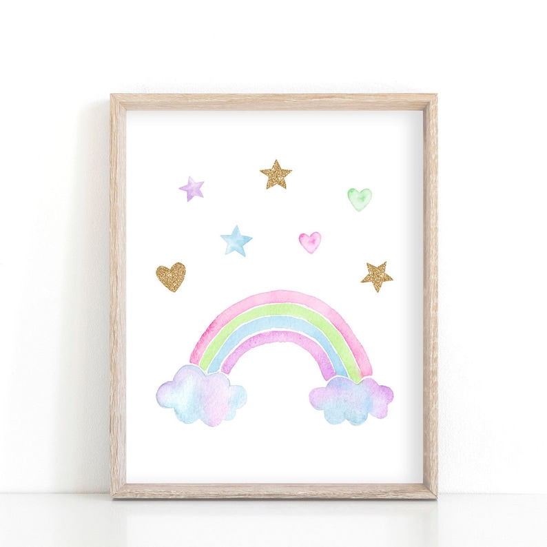 May include: A framed print with a watercolor rainbow with clouds and gold glitter stars and hearts on a white background.