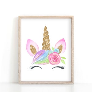 May include: A watercolor illustration of a unicorn head with a gold glitter horn, pink ears, and a floral crown. The unicorn has closed eyes and eyelashes.