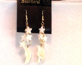 White mother of pearl star and moon sea shell carved  dangle earrings