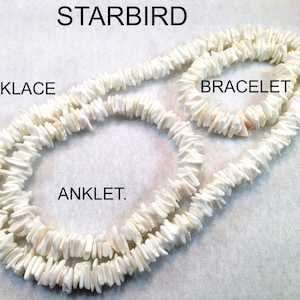May include: White shell necklace, bracelet, and anklet set. The set is made of small, white, flat, irregular shaped pieces of shell. The necklace is the longest, followed by the anklet, and then the bracelet.
