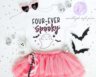 May include: A white t-shirt with a pink ghost and the text "FOUR-EVER SPOOKY" in black and pink lettering. The shirt is paired with a pink tulle tutu.