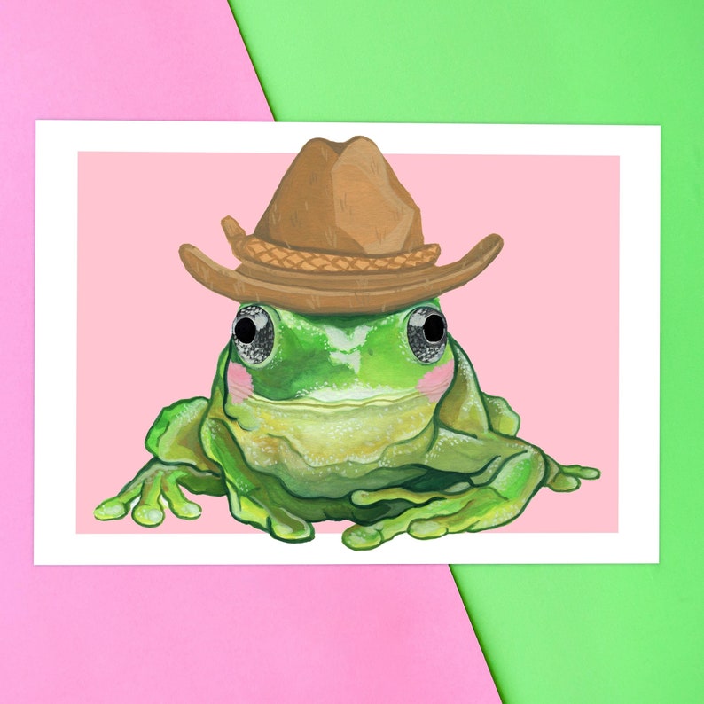 Cute blushing frog wearing a cowboy hat. Yeehaw howdy cowboy frog. Frog painting by Emily Peet Illustration. Frog in hat, funny art.