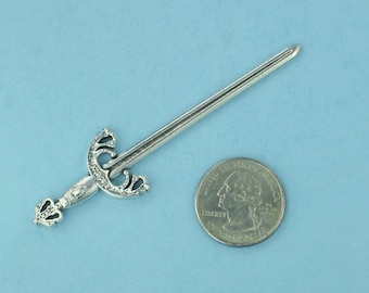 May include: A silver sword with a decorative handle and a pointed tip. The sword is about the size of a quarter.