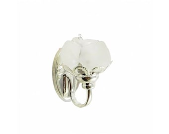 May include: Silver wall sconce with two frosted glass shades in the shape of roses.