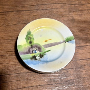 Set of 4 hand painted plates