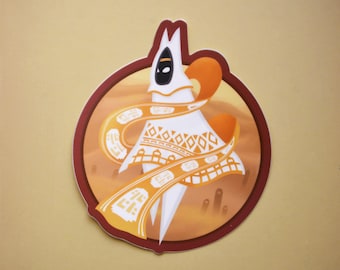 May include: A white character with a black mask and a patterned orange scarf, standing on a desert background. The character is surrounded by a red circle.
