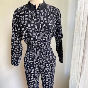 vintage hieroglyphics jumpsuit, 90s black high neck jumpsuit, vintage printed jumpsuit, vintage black onesie, Med/L