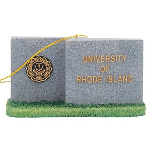 May include: A gray stone ornament with a gold rope hanger. The ornament is shaped like a sign with the text "UNIVERSITY OF RHODE ISLAND" and a seal with the text "UNIVERSITY OF RHODE ISLAND 1892".