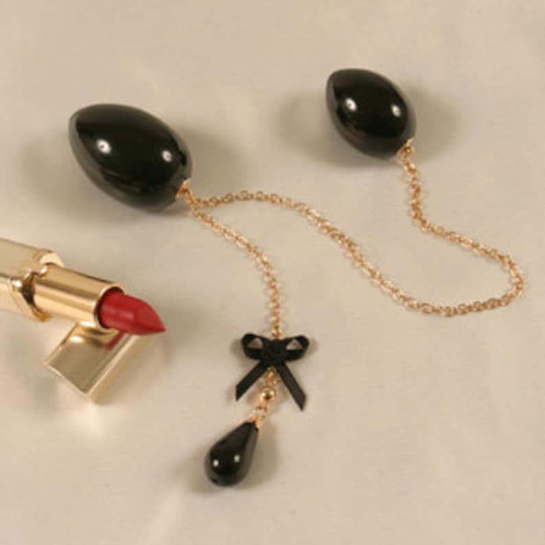 Insertable Black Double Penetrating Eggs with Gold Chain and Bow image 1