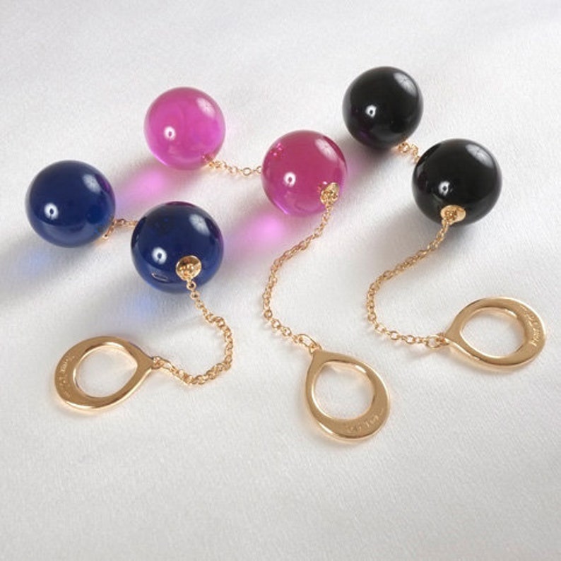 Insertable Black Double Penetrating Eggs with Gold Chain and Bow 