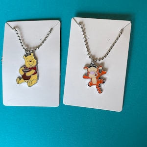 Winnie the Pooh and tigger charm necklaces
