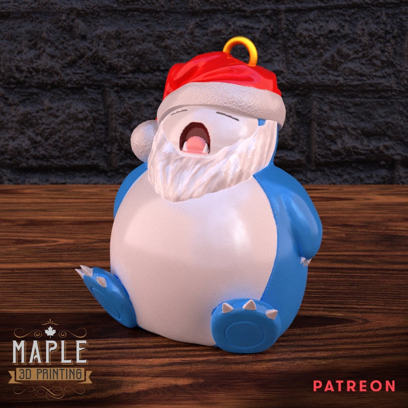 May include: A blue and white Christmas ornament shaped like a cartoon character wearing a Santa hat. The character has a white beard and is yawning.