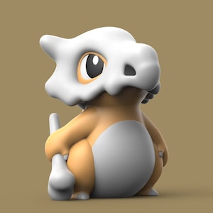 May include: A 3D-rendered Cubone figure, a Pokémon character, in a sitting pose. The figure features a white skull-like helmet, a tan body, and a gray belly. The figure is set against a solid tan background.