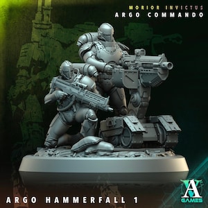 May include: A gray plastic miniature wargaming set featuring three soldiers and a vehicle. The soldiers are armed with rifles and the vehicle has a large cannon. The set is labeled "Argo Commando" and "Argo Hammerfall 1".