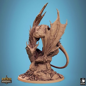 May include: A detailed brown dragon figurine perched on a rocky base, with a tail curled to the side. The dragon has large wings and a menacing expression. The base is littered with skulls and bones. The text "RATKIN ARSENAL" is visible.