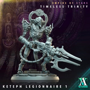 May include: A grey plastic miniature figurine of a skeletal creature with a large weapon. The creature is wearing armour and has a large head with a skull-like face. The weapon is a large, futuristic gun with a blade attached to the end. The figurine is standing on a base with the text "KETEPH LEGIONNAIRE 1" printed on it. The text "EMPIRE OF STARS TIMELESS TRINITY" is printed at the top of the image. The text "A GAMES" is printed in the bottom right corner of the image.