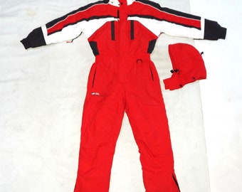 May include: Red ski suit with a black, white, and red striped jacket and a matching red hood. The suit has a black zipper and a black logo that says "SKI LIFE" on the left leg.