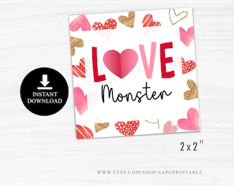 May include: A printable Valentine's Day card with a white background and red, pink, and gold hearts. The card says "LOVE Monster" in red and black letters. The card is 2x2 inches.