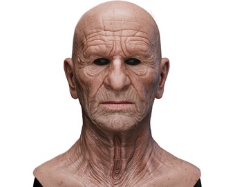 May include: A realistic silicone mask of an elderly man with a bald head and detailed wrinkles. The mask is a light brown color and has a neutral expression.
