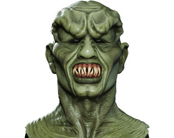 May include: A green monster mask with sharp teeth and a menacing expression. The mask is made of a textured material and has a realistic appearance.